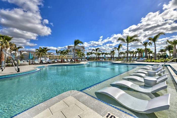 pool with chairs in the water