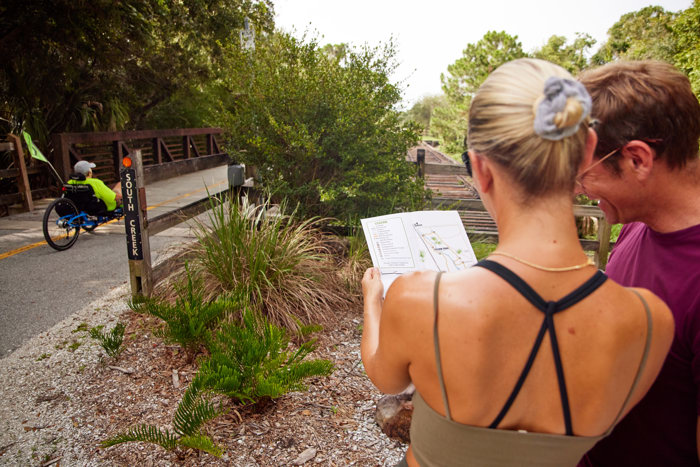 friends exploring the trail maps